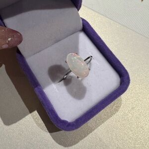 White opal stone on 925 silver setting

Adjustable